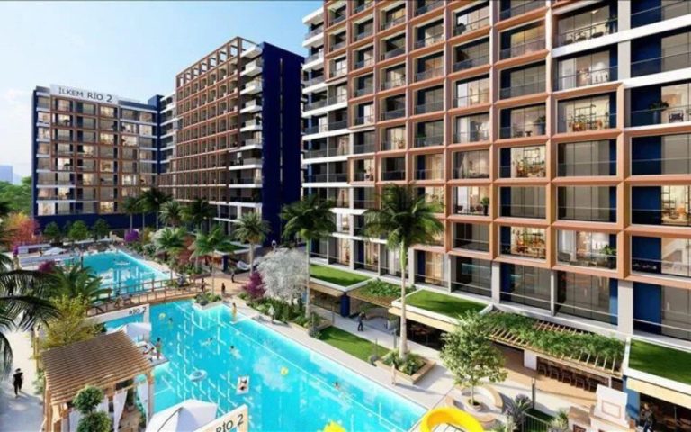 Modern apartment residences around a shared pool, an example of homes currently offered for sale in Turkey